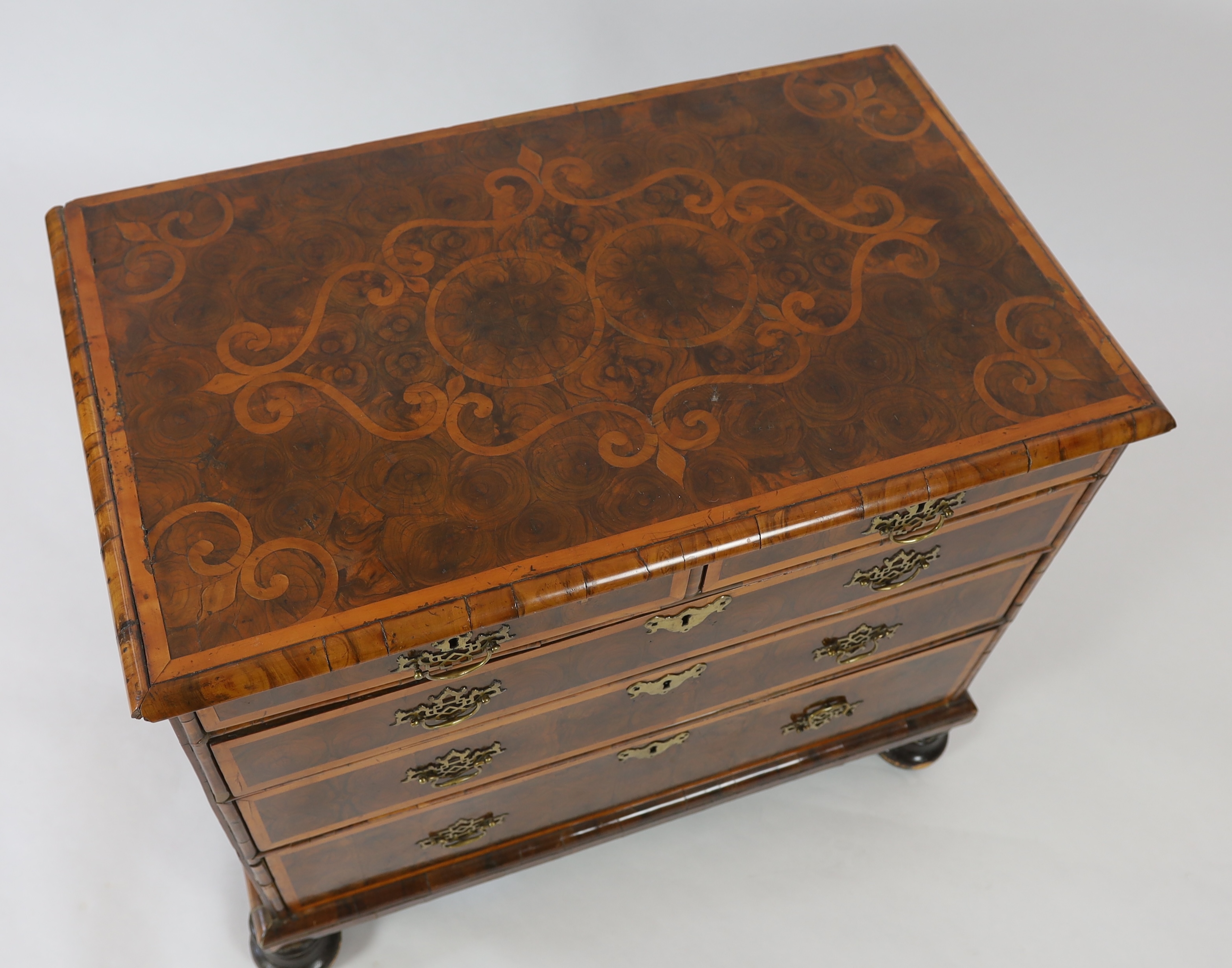 A William and Mary oyster veneered laburnum and walnut chest